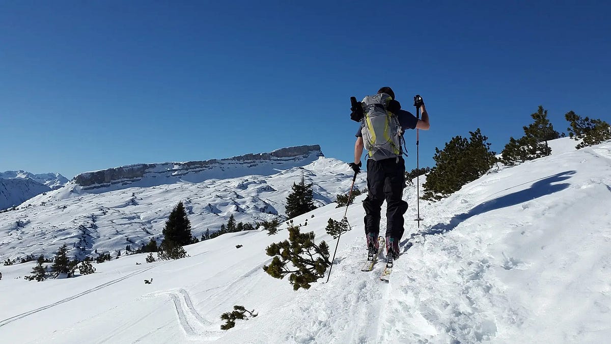 What are the essential tips for a beginner’s alpine touring journey?